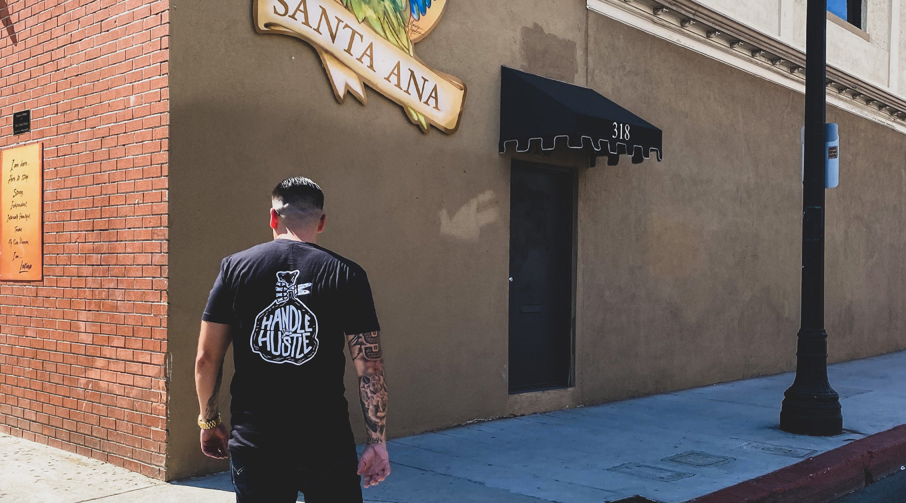 Handle Your Hustle Clothing, Standing in Downtown Santa Ana, Man in front of building